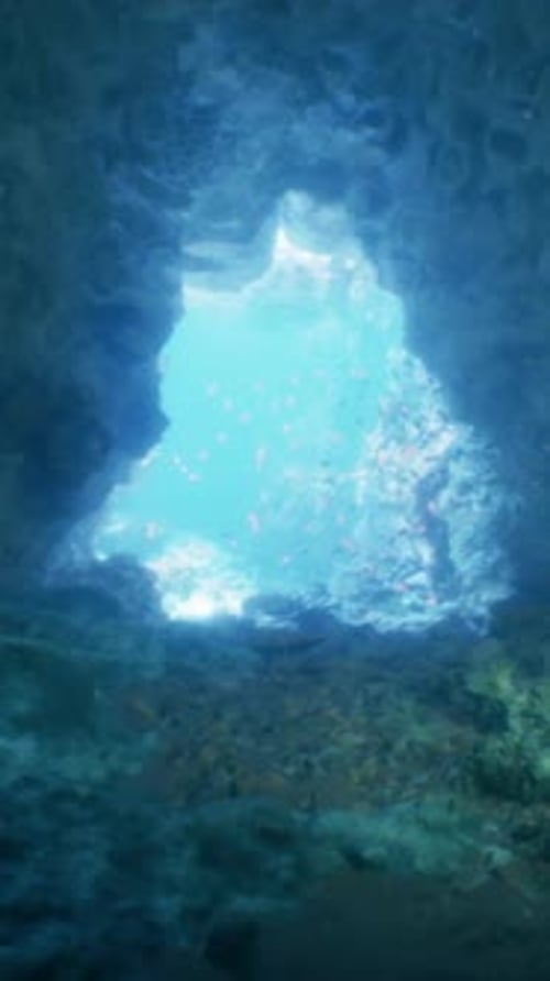 A Cave with a Blue Light Coming Out of It