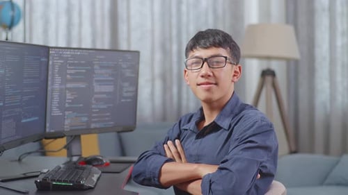 Asian Boy Programmer Smiling And Crossing Her Arms While Creating Software Engineer Developing App