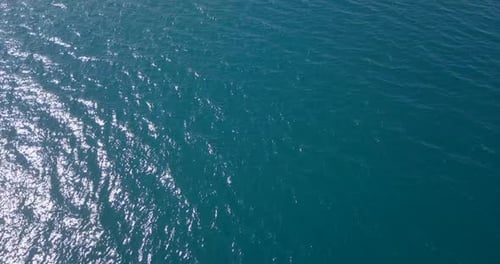 Aerial footage over clear ocean water