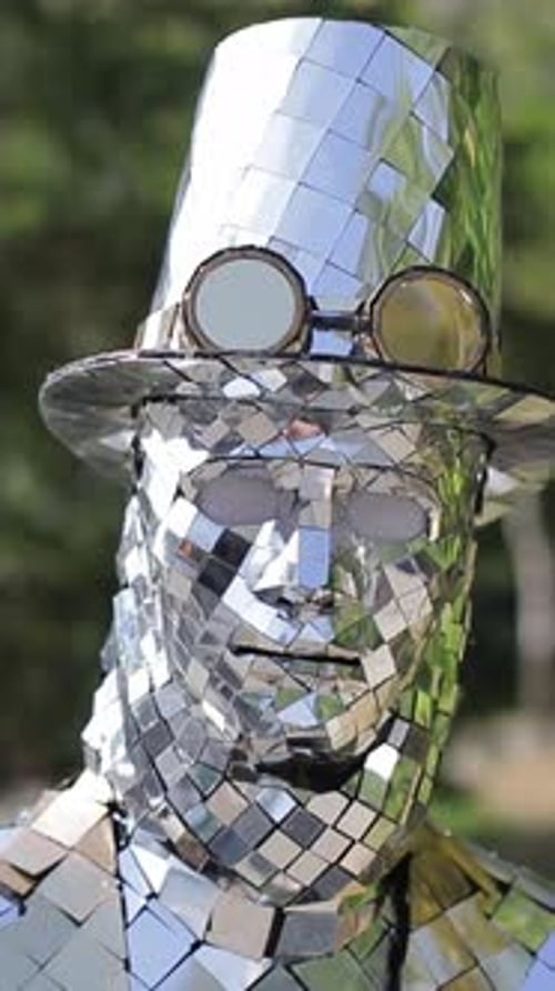 Mirrored Man Wearing Silver Top Hat Outdoors