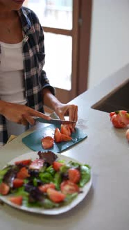 Woman Prepares Fresh Tomato Salad in Kitchen