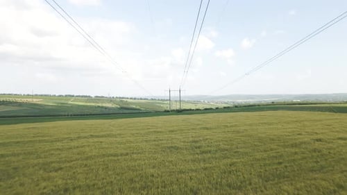 Aerial View of High Voltage Power Lines in Countryside