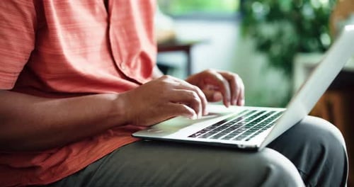 Man, hands and typing in house with laptop for remote work, marketing proposal