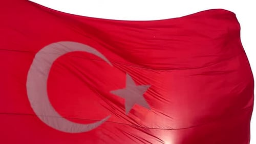Really big turkish flag in slow motion and sunlight leaks, turkey country