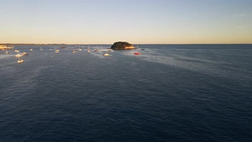Aerial view of serene beach with sailing boats, United States.