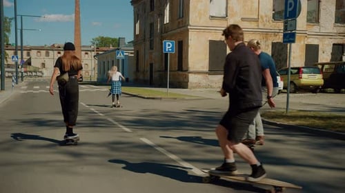 Stylish Cool Teenagers Skating. Two Girls and Two Boys Riding on Skateboards and Longboards Through