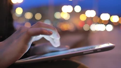 Woman Using Tablet Pc Outdoors Night City Lights Background