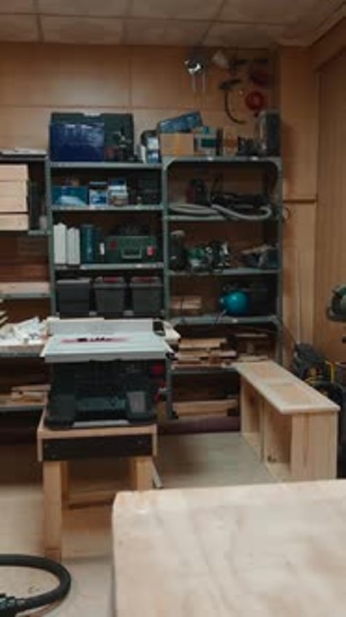 Professional Artisan's Woodworking Workshop with a Table Saw and Equipment