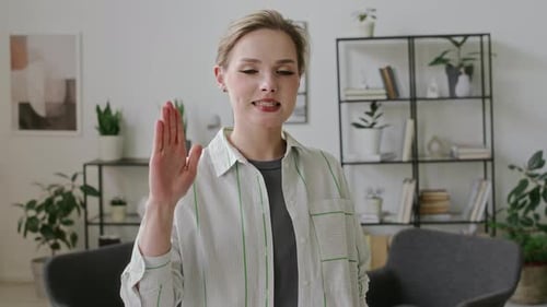 Woman Gesturing and Communicating with Hands Indoors