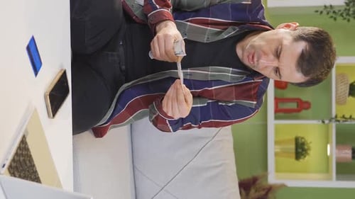 Vertical Video of The angry man who was surprised after looking at the end-of-month bills.