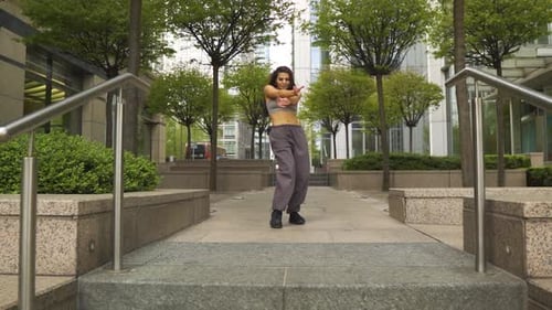 innfluential instagram famous dancer performing her moves in a small modern park outdoor London red