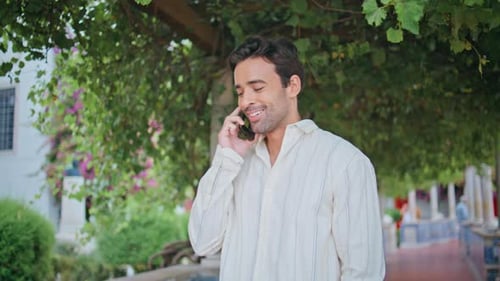 Laughing Guy Calling Mobile Phone at Cozy Alley Closeup Man Talking Smartphone