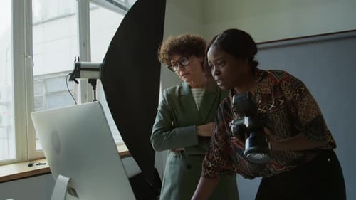 Photographer and Art Director at Work in Photo Studio