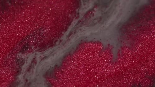 Abstract Flowing Gray Liquid on Sparkling Red Surface
