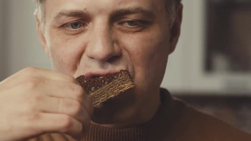 Man Eating Cake