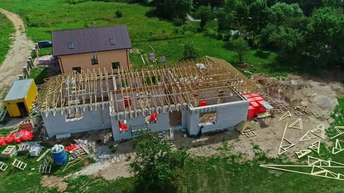 Unfinished House Construction with Wooden Roof Trusses