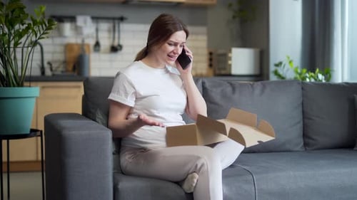 Distraught Woman Talking On Phone About Delivery