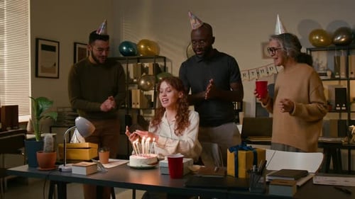 Young Woman Taking Selfies with Colleagues During Birthday Party in Office