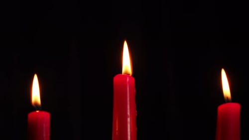 Close Up Shot of Burning Red Candles