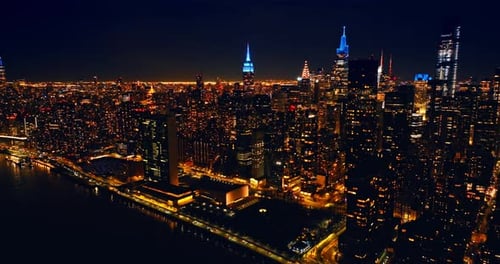 Breath-taking scenery of night New York, the USA. Dazzling illumination of metropolis