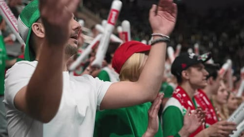 Tense baseball fans cheer at arena stadium. Crowd applaud sport stands. Win bet.