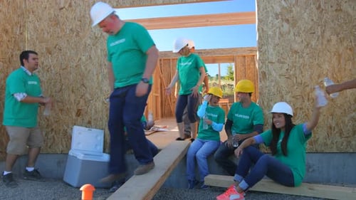Volunteers take a break at construction site