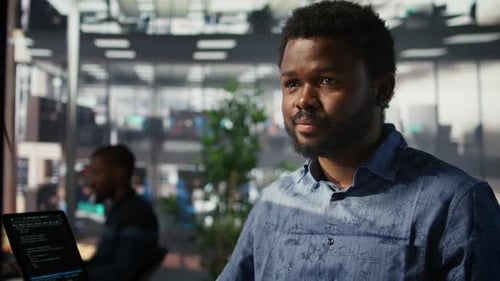 Man Doing Data Entry Typing on Keyboard on Computer in Office
