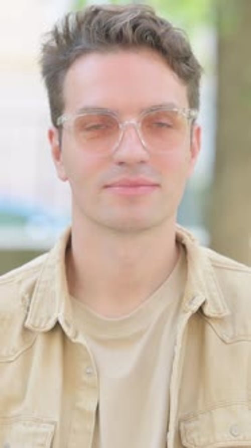 Smiling Man Gives Thumb Up Approval Outside