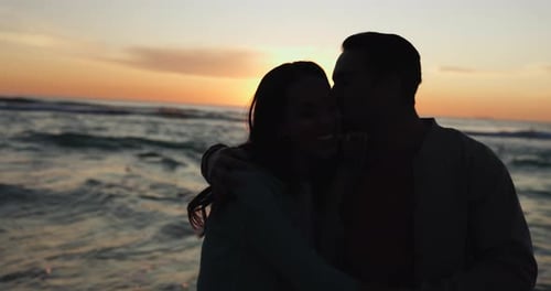 Beach sunset, kiss and relax couple silhouette, hug and bond on romantic date
