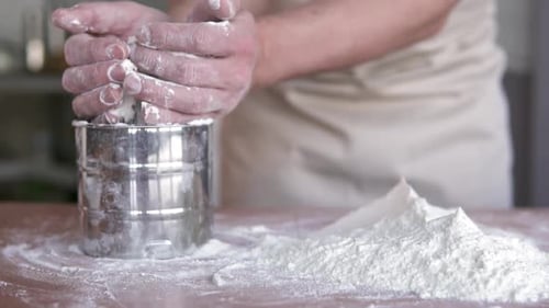 Hands Preparing Flour for Baking in Kitchen