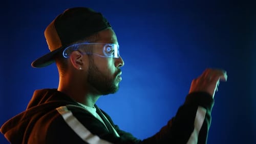 Man Interacts With Augmented Reality Futuristic Glasses