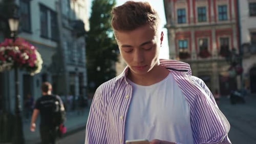 Face Young Happy Man Stand on Street Use Phone Look at Camera Smile Sunlight Cute Work Mobile Gadget