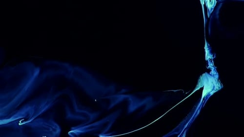 Abstract Blue Paint Swirling on Black Background