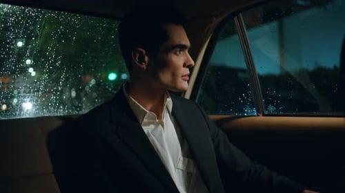 Young Adult Rides in Car at Night