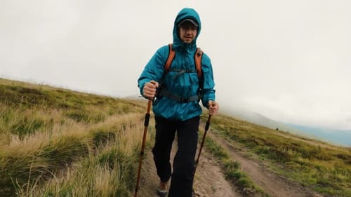 Tourist on the Trail in Mountains