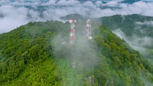 Mist flowing over the summit Above is a telecommunications station.