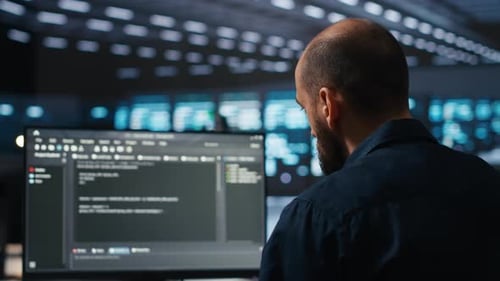 Focused Coder Working in Modern Futuristic Office