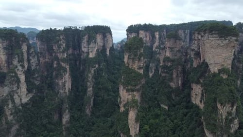 Zhangjiajie National Park in China; Drone Approaching Vertical Sandstone Pillars also known as "Hall