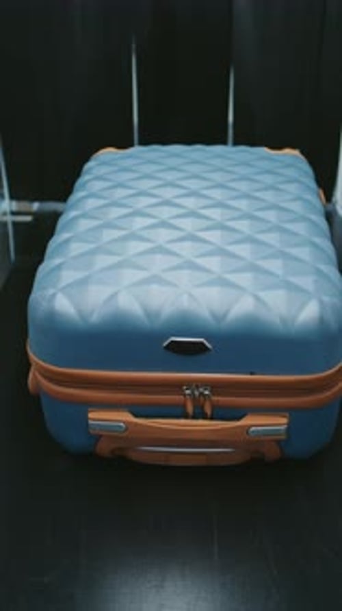 Zooming Close Up of Suitcases
