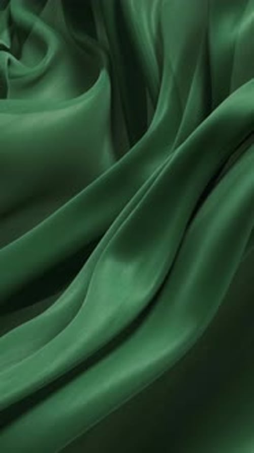 Flowing green wave cloth background