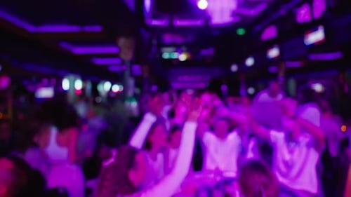 Blurred Nightlife Scene: Dancing in a Busy Club