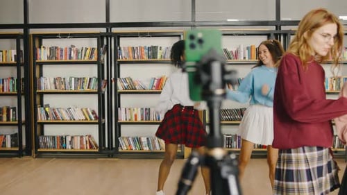 Group of Women Dancing in Library for Video