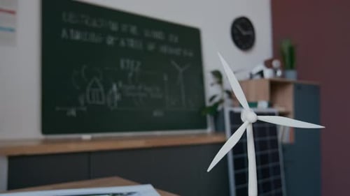 Blackboard and Wind Turbine Model in Classroom for Science Lesson