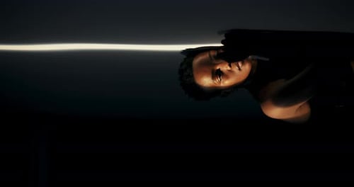 Artistic Portrait of Glamorous Young Adult Posing in Dark