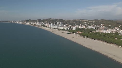 Aerial flight to wide empty sandy beach on Adriatic coast, Albania