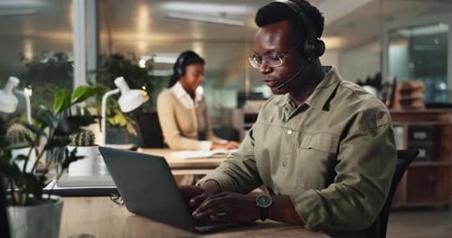 African man, call center and laptop at office with typing, reading and telemarketing at night