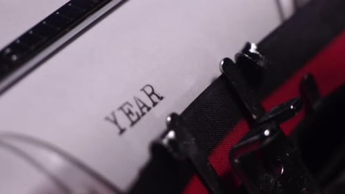 Year 1969, Typing in Vintage Typewriter on Blank White Paper, Close Up