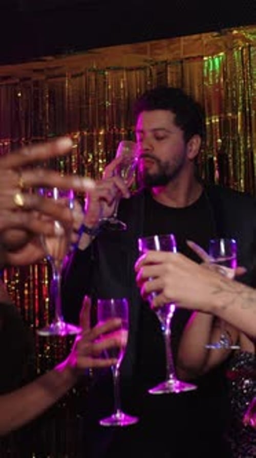 Friends Celebrate Together with Drinks at Night