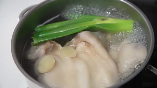 Bubbling Broth Cooking in a Steel Pot