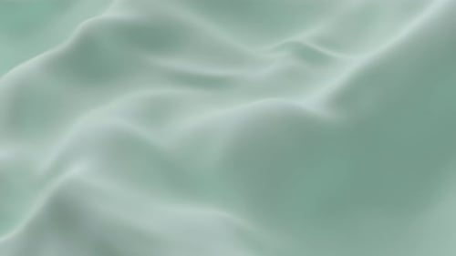 Soft Mint Green Silk Fabric Gently Rippling Smooth Waves Creating Elegant Minimal Background Texture